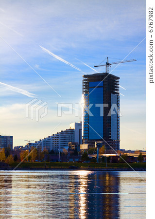 Industrial construction crane near the skyscraper in Krasnoyarsk Industrial construction crane near the skyscraper in Krasnoyarsk 6767982