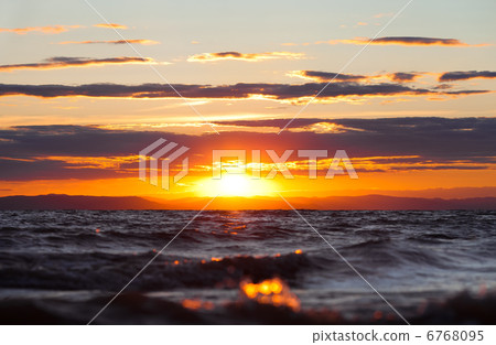 sunset at coast of the sea 6768095