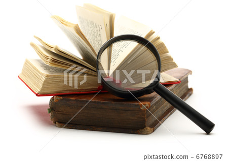 Magnifying glass and old books Magnifying glass and old books 6768897
