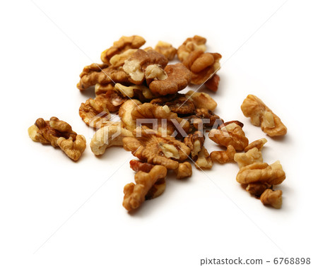 Heap of walnuts on white background Heap of walnuts on white background 6768898