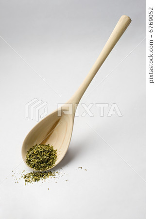 Spoon and parsley isolated on white Spoon and parsley isolated on white 6769052