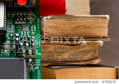Computer system board and old books Computer system board and old books 6769255
