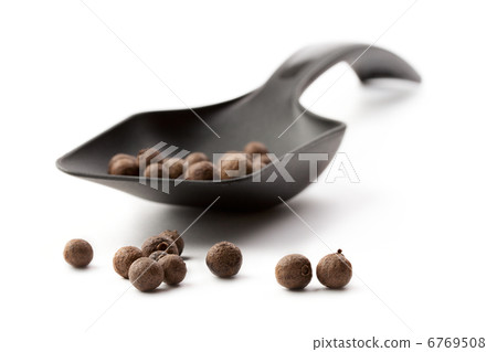 Spoon and pepper isolated on white 6769508