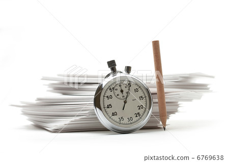 Pile of paper cards with pencil and stopwatch Pile of paper cards with pencil and stopwatch 6769638