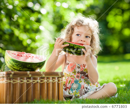 Child eating watermelon 6771803