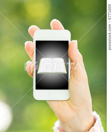 Smartphone with book in woman hand 6771809