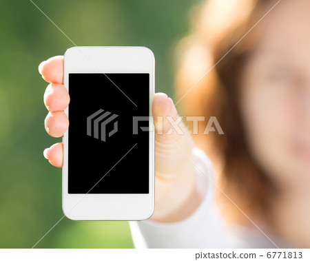Woman holding smart phone Woman holding smart phone 6771813