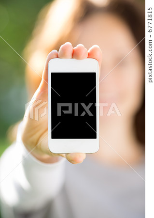 Woman holding smart phone Woman holding smart phone 6771815