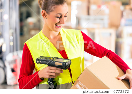 worker scans package in warehouse of forwarding 6772272