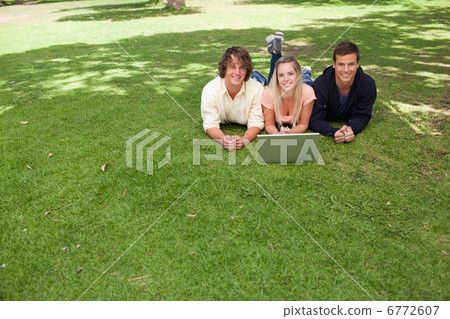 Three smiling students looking at camera Three smiling students looking at camera 6772607