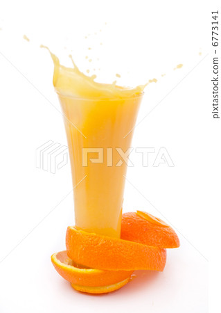 orange peel surrounded around a overflowing glass 6773141