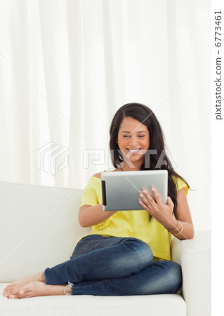 Happy Latino using a touch pad Happy Latino using a touch pad 6773461