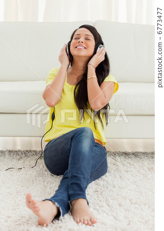 Pretty Latin enjoying music Pretty Latin enjoying music 6773477