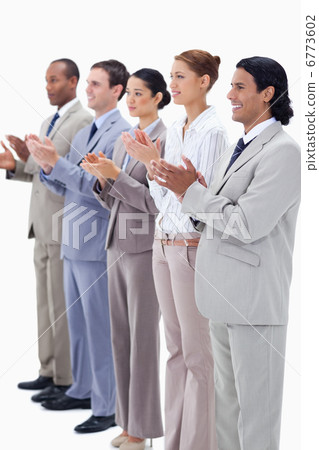 People dressed in suits smiling and applauding People dressed in suits smiling and applauding 6773602