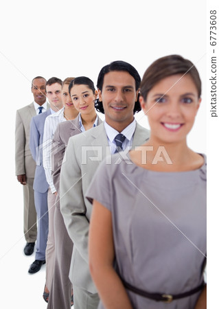 Close-up of co-workers in a single line looking straight Close-up of co-workers in a single line looking straight 6773608