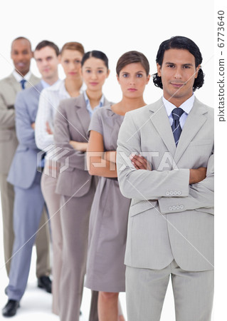 Close-up of colleagues crossing their arms in a single line Close-up of colleagues crossing their arms in a single line 6773640