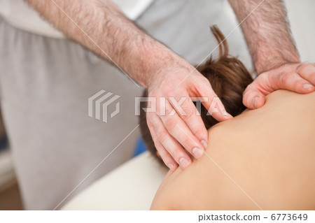 Chiropractor touching the back of his patient Chiropractor touching the back of his patient 6773649