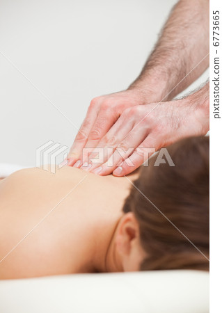 Close-up of woman being massaged by a doctor 6773665