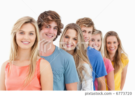 A smiling group standing behind each other A smiling group standing behind each other 6773720