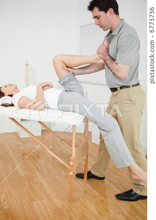 Woman putting her foot on the chest of her doctor Woman putting her foot on the chest of her doctor 6773736