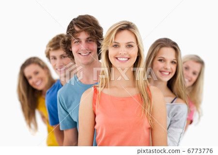 Group standing behind one another at varied angles 6773776