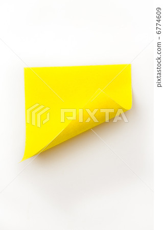 Close up of a yellow curved adhesive note Close up of a yellow curved adhesive note 6774609