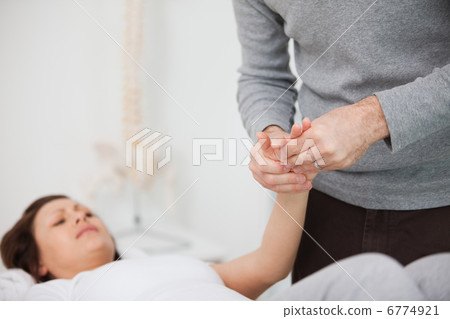 Physiotherapist massaging a painful hand Physiotherapist massaging a painful hand 6774921