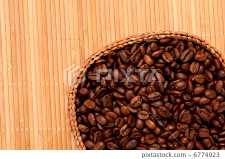 Basket filled with coffee beans Basket filled with coffee beans 6774923