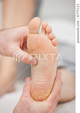 Doctor pressing the sole of a foot with his thumb Doctor pressing the sole of a foot with his thumb 6775121