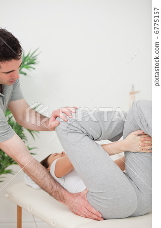 Close-up of a physiotherapist helping a woman for her exercise Close-up of a physiotherapist helping a woman for her exercise 6775157