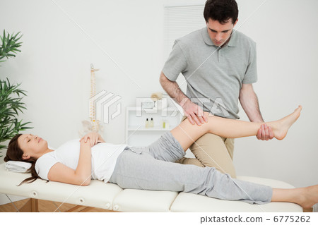 Peaceful brunette woman lying on a medical table Peaceful brunette woman lying on a medical table 6775262