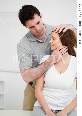 Osteopath insuring central alignment of spine Osteopath insuring central alignment of spine 6775263