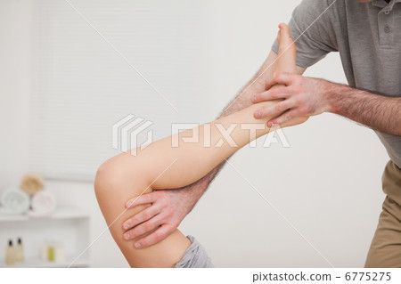 Leg being stretched by a doctor Leg being stretched by a doctor 6775275