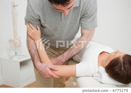 Woman lying while being massaged Woman lying while being massaged 6775279