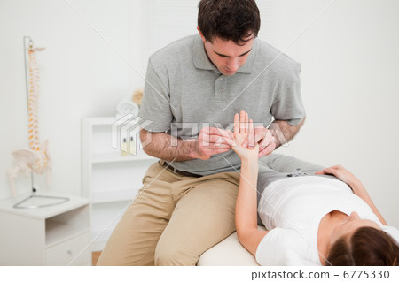 Brunette woman lying on a medical table Brunette woman lying on a medical table 6775330