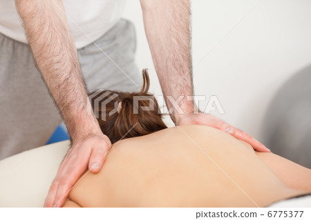 Shoulders of woman being massaged by doctor Shoulders of woman being massaged by doctor 6775377
