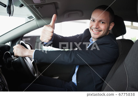 Man driving a car Man driving a car 6775838