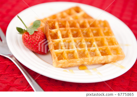 Waffles and strawberry together in a white plate Waffles and strawberry together in a white plate 6775865