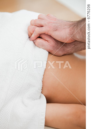 Close-up of doctor massaging the back of his patient Close-up of doctor massaging the back of his patient 6776206