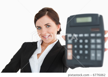 Smiling woman in black suit showing a calculator Smiling woman in black suit showing a calculator 6776862