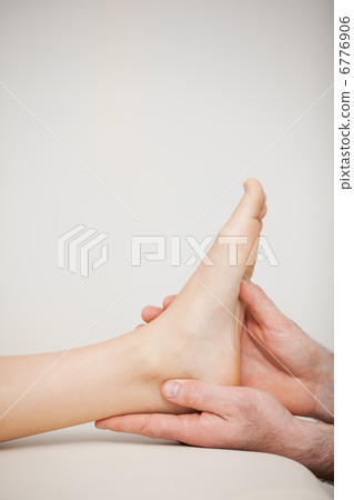 Close-up of a foot being held by a doctor Close-up of a foot being held by a doctor 6776906