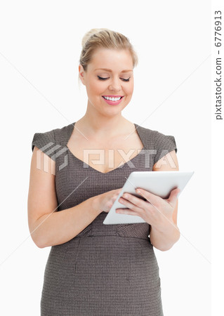 Woman using a tablet pc Woman using a tablet pc 6776913