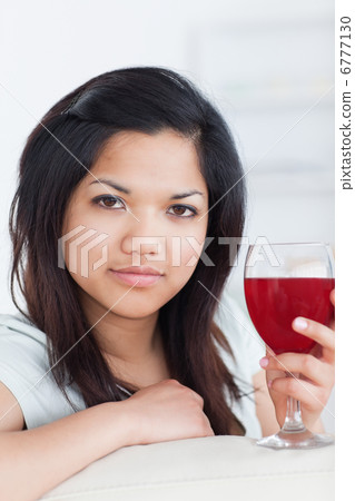 Close-up of a woman holding a glass of wine Close-up of a woman holding a glass of wine 6777130