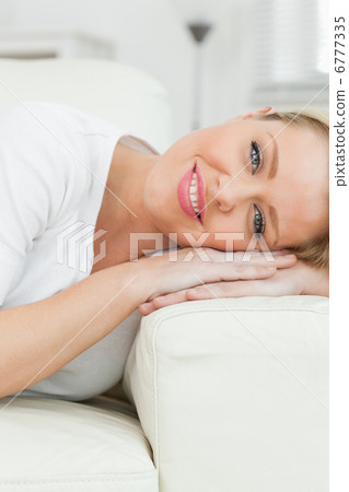 Woman smiling while she rests 6777335