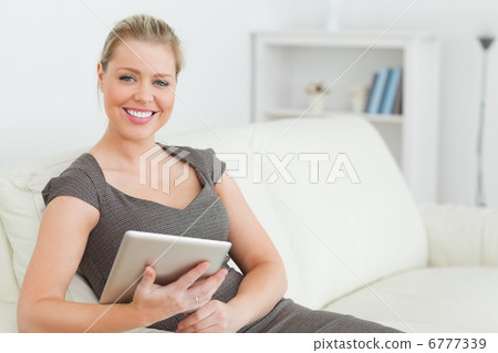 Woman holding an ebook 6777339