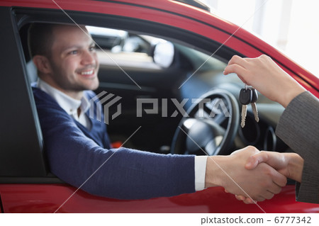 Client shaking hand to a woman Client shaking hand to a woman 6777342