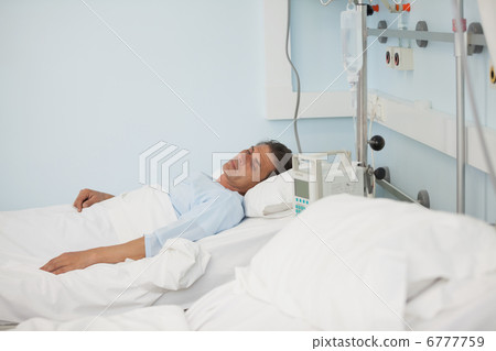 Male patient lying on a medical bed 6777759