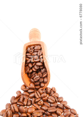 Wooden shovel filled of coffee beans Wooden shovel filled of coffee beans 6778080