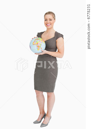 Businesswoman holding a globe in her hands 6778231