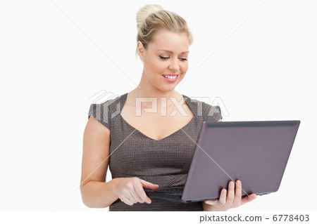 Woman browsing on a laptop 6778403